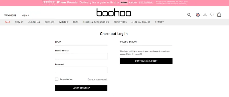 Boohoo checkout log-in page with a Continue As A Guest button beside the sign-in form
